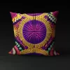 Ndebele Nebula pillow cover featuring vibrant circles and semi-circles on a purple background.