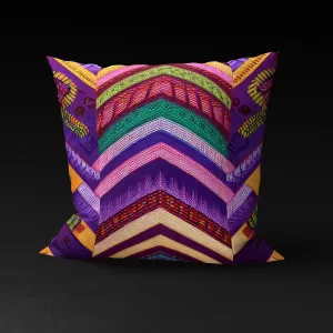 Venda Vibrance pillow cover featuring colorful central chevrons and intricate side patterns on a purple background.